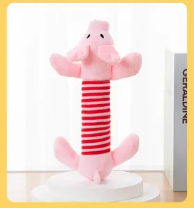 Detailed view of long pink pig plush dog toy featuring a red and white striped body