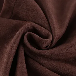 Close-up of premium brown suede fabric texture with soft matte finish detail