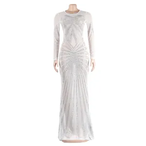 Elegant white floor-length evening gown with intricate rhinestone sunburst pattern