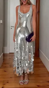 Elegant sleeveless silver sequin evening dress with large disk paillette hem detail