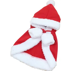 Festive red Christmas pet cloak with white plush trim and pom-poms for dogs and cats.