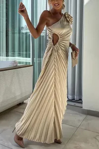 Elegant champagne gold one-shoulder pleated maxi dress with waist cut-out detail.