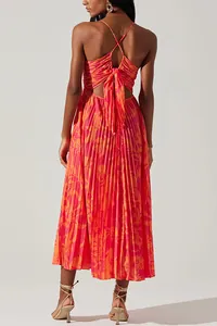 Detailed back view of a floral pleated midi dress featuring a cutout and tie-back bow.