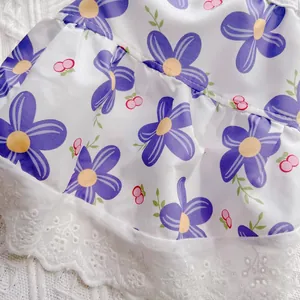 Macro detail of breathable purple floral pet princess dress with delicate white lace trim