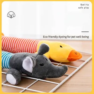 Squeaky plush dog toys in cute elephant and duck shapes on a white metal rack stand.