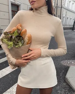 French vintage high-waisted suede mini skirt shown in a stylish street fashion setting.