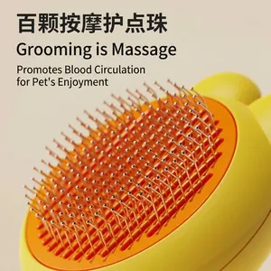 Professional self-cleaning pet brush featuring stainless steel needles and protective massage beads