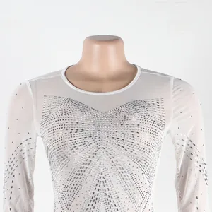 Detail of white sheer mesh top with intricate silver rhinestone hot-drill patterns