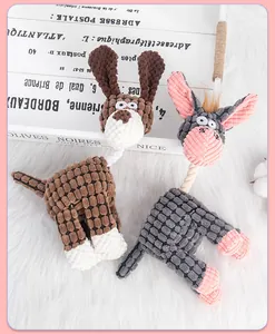 Close-up of plush pet toys showing corduroy texture and sturdy cotton rope neck