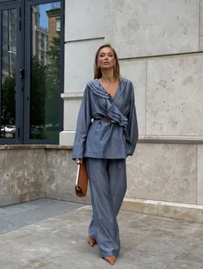 Elegant blue-grey tencel set with ruffle wrap top and wide-leg pants in street style