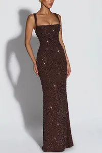 Elegant brown sequin evening gown with spaghetti straps and slim fit silhouette.