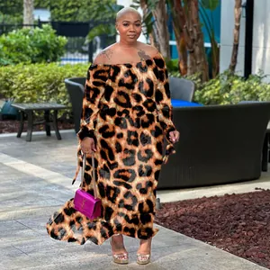 Detailed view of a sexy leopard print off-the-shoulder maxi dress on a model