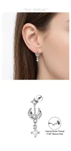 Detailed view of moon and star piercing stud with F136 titanium internal screw post
