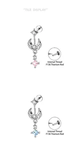 Detail of star and moon cartilage piercings with F136 titanium internal threading.