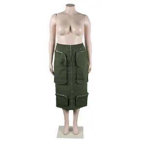 Close-up detail of an olive green cargo midi skirt with four zipper pockets on a mannequin.