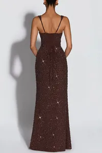 Detailed back view of a stunning brown sequined evening gown with lace-up strap details.