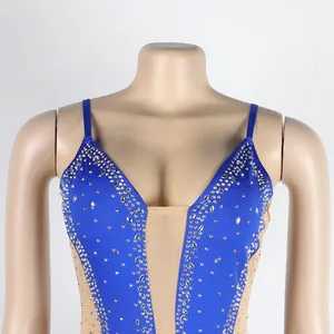 Detailed macro view of silver rhinestones and blue mesh on this sexy strap evening dress