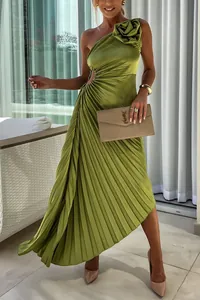 Detailed view of an elegant green one-shoulder pleated dress featuring 3D flower and cutout.