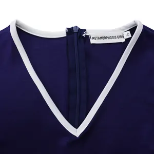 Detailed view of the V-neckline and back zipper on a navy blue elegant pencil dress.