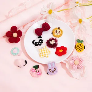 Cute assorted embroidered pet hair clips featuring floral, panda, and fruit shapes