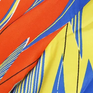 Close-up detail of vibrant geometric print fabric for slim fit colorful V-neck dress