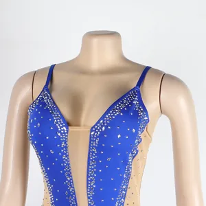 Detailed macro view showing sparkling silver rhinestones on a blue and nude mesh bodysuit