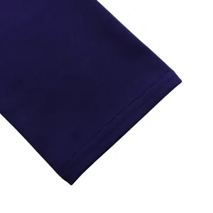 Close-up of deep purple knit dress sleeve showing durable double-stitched hem texture