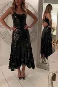 Elegant sleeveless black sequined dress with backless detail for banquet and evening events