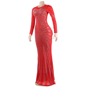 Close-up detail of red floor-length evening dress with rhinestone sunburst pattern