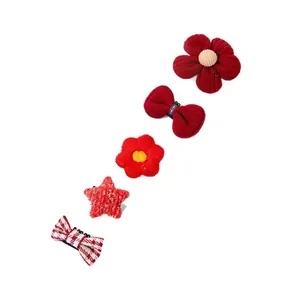 Set of five red pet hair clips featuring flowers bows and stars for dogs and cats