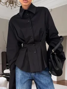 Elegant black pleated waist shirt with long sleeves for a slimming office look
