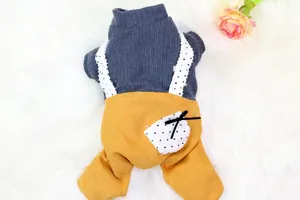 Close-up detail of a mustard yellow pet overall set with a grey ribbed sweater