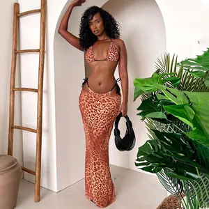 Three-piece leopard print bikini set with matching long skirt on fashion model