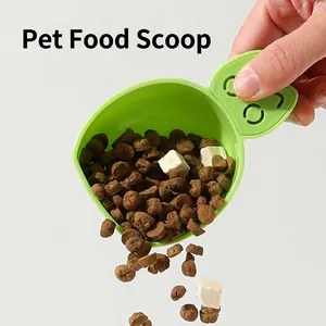 Pala de plástico verde para comida de mascotas con mango en forma de orejas de gato