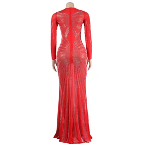 Detail of the back view of a red floor-length gown with sparkling silver rhinestones