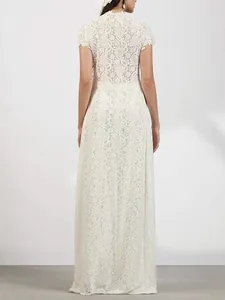 Detailed back view of a beautiful white floral lace long dress for elegant women