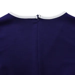 Close-up macro view of the back neckline and blue invisible zipper on a navy pencil dress