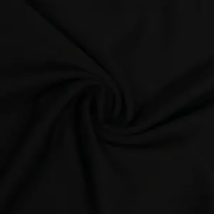 Detalle macro que muestra la suave textura y el tejido del material de punto negro