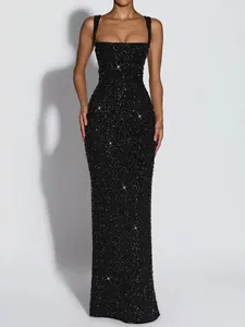 Macro detail of a sparkling black sequined sleeveless evening gown with shimmer