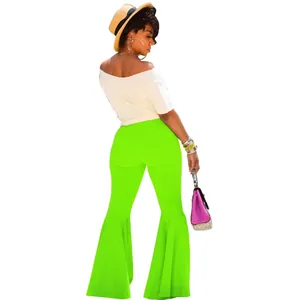 Vista trasera de pantalones acampanados verde neón sexy con dobladillo con volantes