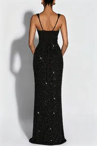 Elegant back view of shimmering black sequined evening gown with lace-up corset design
