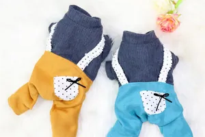 Detail of warm fleece pet overalls in yellow and blue with cute polka dot pockets