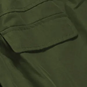 Close-up detail showing the double-stitched pocket flap of this olive green skirt.
