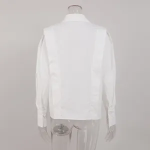 Back detail view of white cotton French style shirt with unique layered panel design