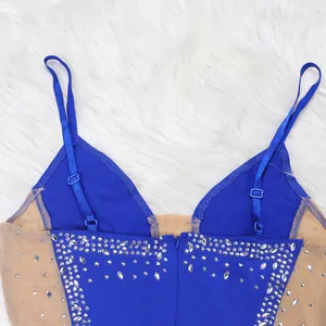 Close-up detail of a blue sexy mesh evening dress with rhinestone spaghetti straps