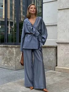 Elegant blue tencel two-piece set with ruffled wrap top and wide-leg trousers