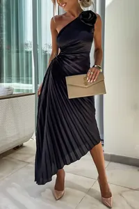 Elegant black one-shoulder pleated dress with floral detail and waist cutout.