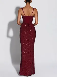 Elegant burgundy sequined evening gown featuring a lace-up back and slim fit silhouette
