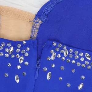 Close-up detail of royal blue evening dress featuring rhinestones and an invisible zipper
