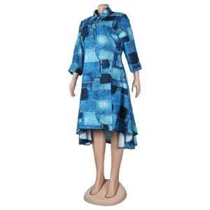 Close-up view of a blue patchwork print shirt dress with a stylish asymmetrical hem